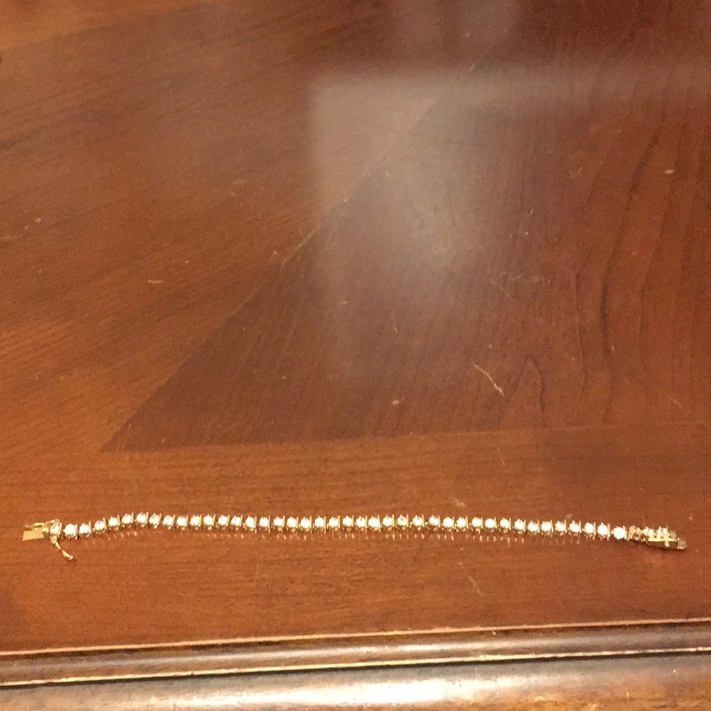 Cubic zirconia and fake gold tennis bracelet